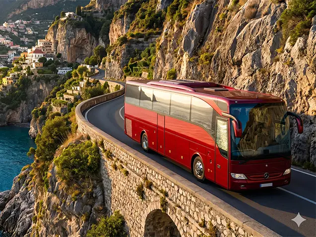 Our premium fleet of luxury Mercedes Vans, executive Minivans, and modern Grand Tourism Coaches parked along the Amalfi Coast highway